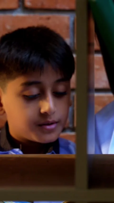 Indian Students in school uniforms browse and search for books in a library Stock Footage 342844336
