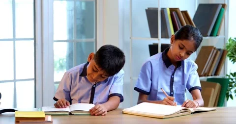 Indian Students in school uniforms raise hands to answer teacher’s question Stock Footage 342850606