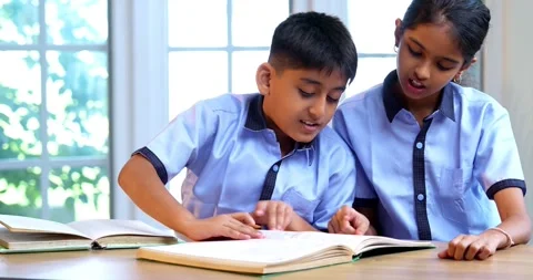 Indian Students in school uniforms raise hands to answer teacher’s question Stock Footage 342850621