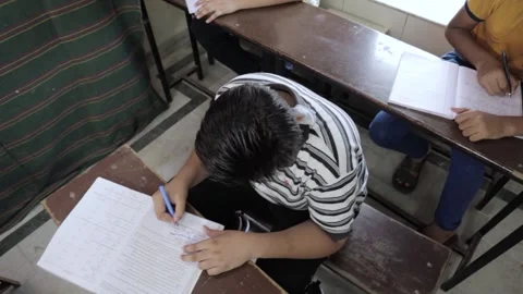 Indian Students Studying In Classroom Wearing Mask, Top Angle Dolly Shot Stock Footage 138138539