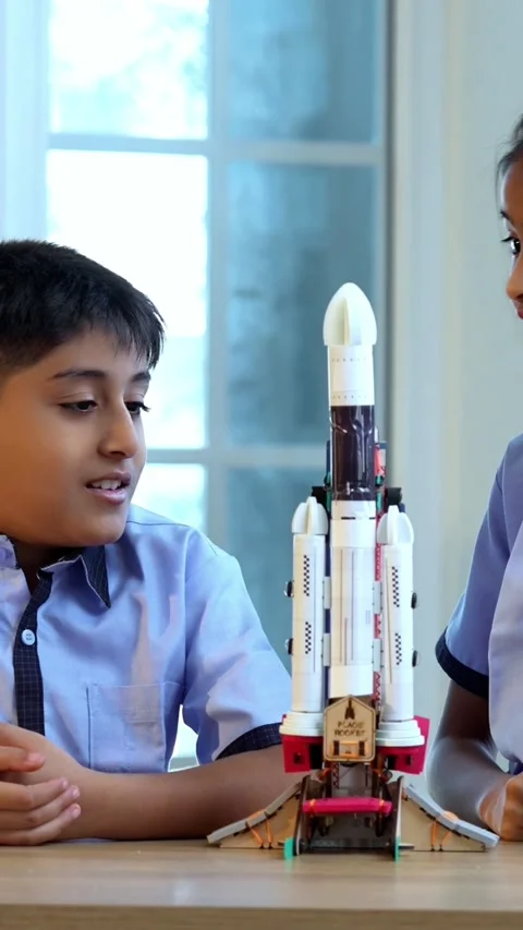 Indian students in uniform test 3D rocket model in classroom Stock Footage 342844165