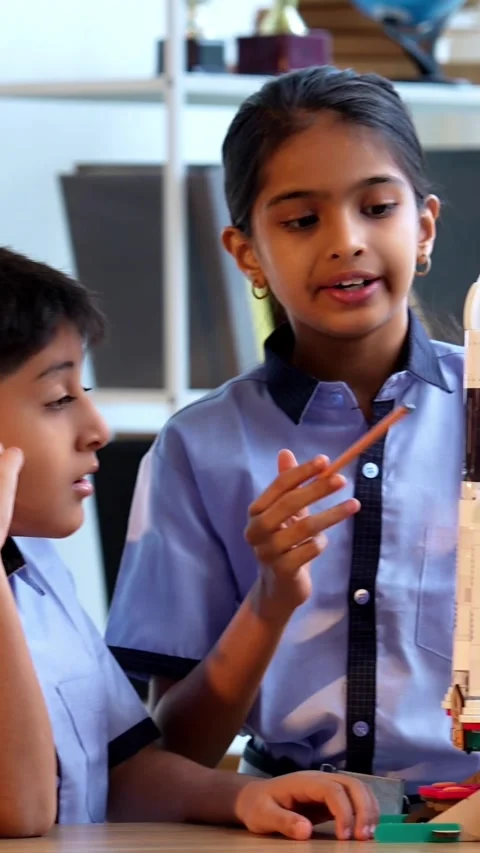 Indian students in uniform test 3D rocket model in classroom Stock Footage 342844169