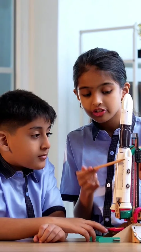 Indian students in uniform test 3D rocket model in classroom Stock Footage 342844173