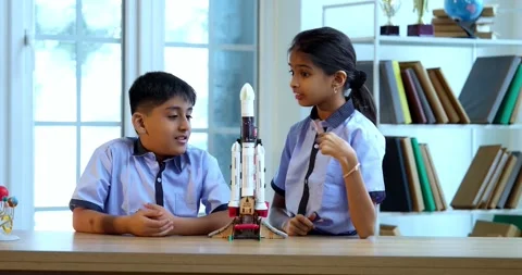 Indian students in uniform test 3D rocket model in classroom Stock-Footage 342849222