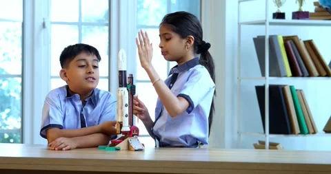 Indian students in uniform test 3D rocket model in classroom Stock Footage 342849228