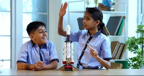 Indian students in uniform test 3D rocket model in classroom Stock Footage 342849229