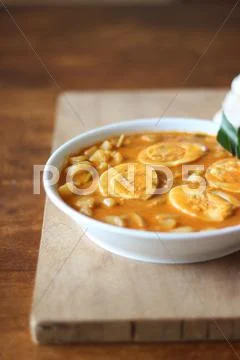 Indian style of Kerala egg curry recipe on wooden cutting board Stock Photos