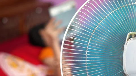 Indian Summer Heatwave Concept with Electric Fan Running in Bedroom. Stock Footage 336460683