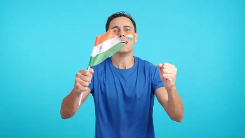 Indian supporter during an exciting march that is ultimately lost Stock Footage 273205459