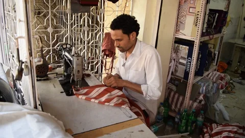INDIAN TAILOR AT WORK Stock Footage 130056509