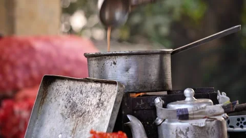 An Indian tea stall making tea for customers in a indian market. Stock Footage 323323887