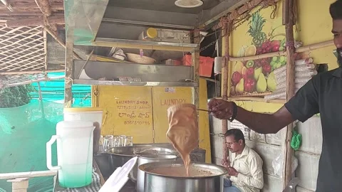 Indian Tea Vendor Making Chai Pouring Tea Hyperlapse Street Stall Hyderabad 2026 Video stock 347069986