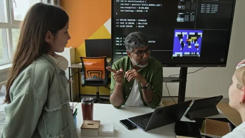 Indian Teacher Explaining Coding to Teenage Girls in Stem Class Stock Footage 342816469