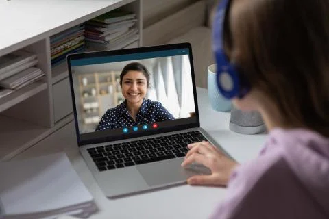 Indian teacher share knowledge with learner using videoconference videocall Stock Photos