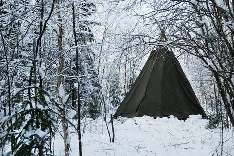 Indian tepee in the winter forest Stock Photos
