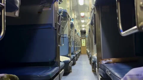 Indian train 3ac coach interior with bunk beds and aisle Stock Footage 332766654