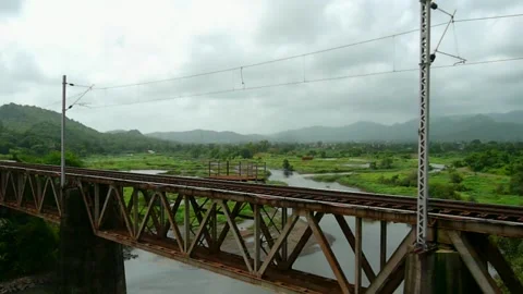 Indian Train Crossing small River Bridge Scenic Green old Rural Village Window Stock Footage 155347593