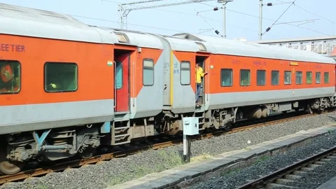 Indian train passes on the tracks Stock Footage 141641404