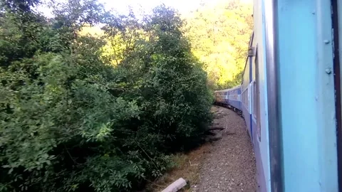 Indian train passing through the valleys and mountains of Konkan Stock Footage 131358014