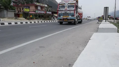 Indian Trucks And Taxis Running On National HIghway 3 Near Road Side Dhaba. Stock Footage 198295076