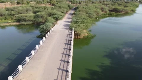 Indian Village River Between farm with a bridge drone view 스톡 동영상 242711684