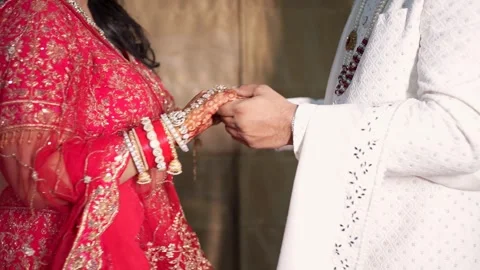 Indian Wedding Couple's Hands During Traditional Ceremony Stock Footage 341946070