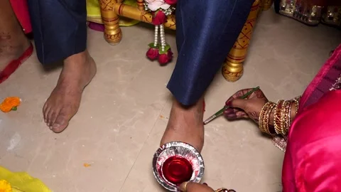 Indian Wedding Ritual with Alta Dye on Groom's Feet Stock Footage 342105221
