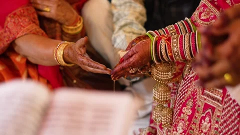 Indian Wedding Ritual with Bride and Groom's Hands Stock Footage 341880548