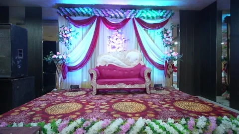 Indian Wedding Stage with Pink Sofa and Floral Backdrop Stock Footage 341945831