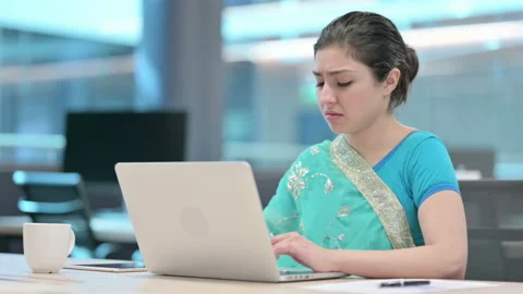 Indian Woman Coughing while using Laptop at Work Видео 152521601