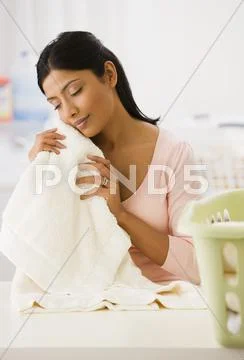 Indian woman feeling soft towel Stock Photos