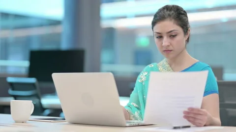 Indian Woman with Laptop Reading Documents 스톡 동영상 152522553