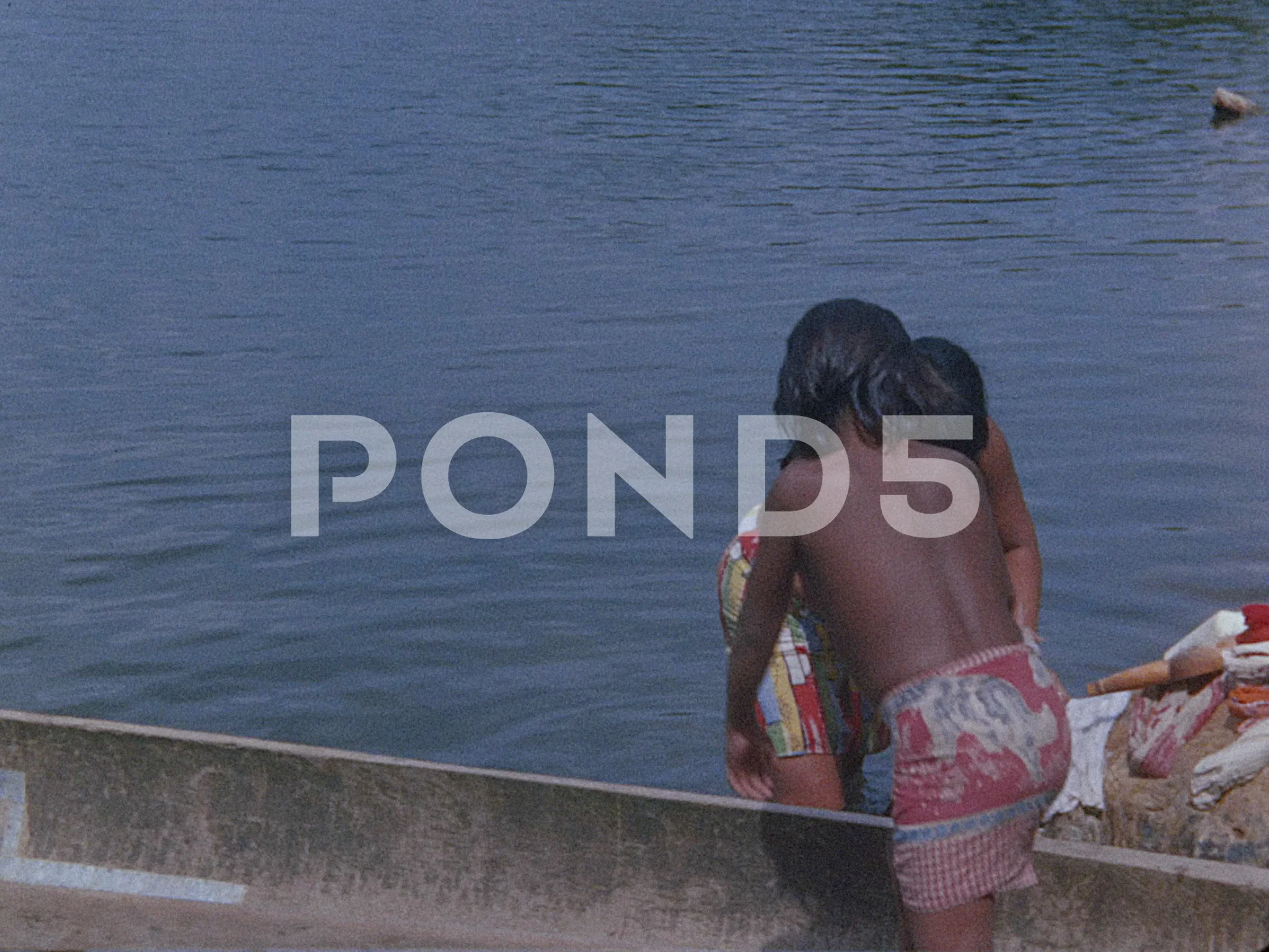 Indian women wash clothes in a jungle ri... | Stock Video | Pond5