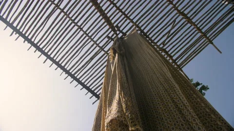 Indian worker air drying traditional block printed textiles. Rajasthan, India. Video stock 151905018