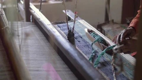 An Indian worker changing cotton threads for a loom in textile factory in India. Stock Footage 151902382