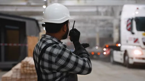 Indian worker coordinating modular home loading process Stock Footage 301821610