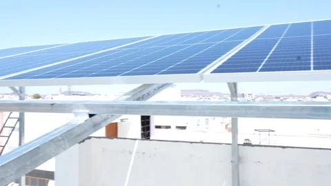 Indian worker installing solar panels on roof of house. Maintenance of phot.. Stock Footage 270753030