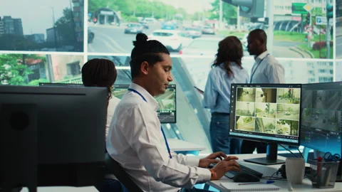 Indian worker operating on license plate registration via CCTV radar footage Video stock 274436583