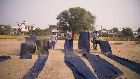 Indian workers air drying traditional block printed textiles. Rajasthan, India. Video stock 151904751