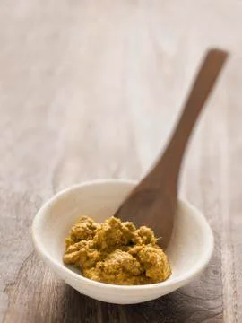 Indian yellow curry paste Stock Photos