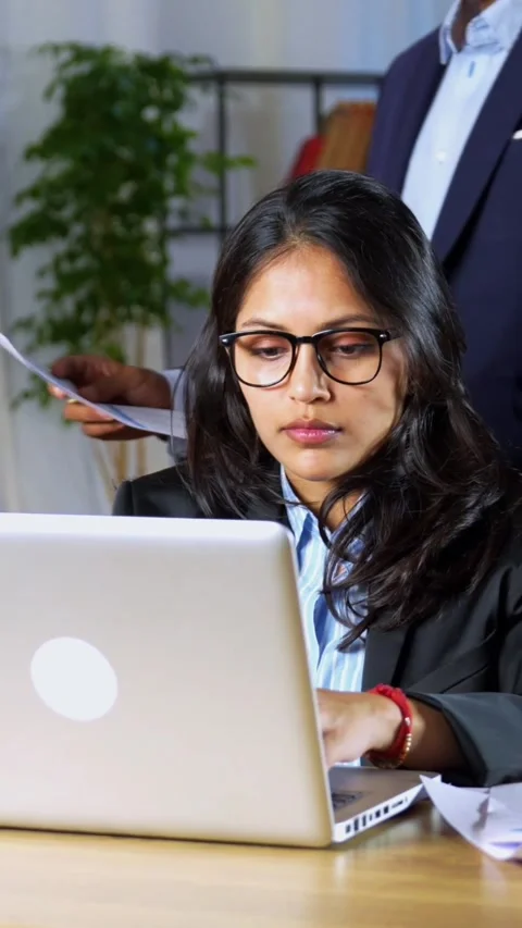 Indian young corporate professionals working in office using laptop Video stock 342574513
