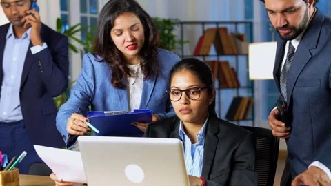 Indian young corporate professionals working in office using laptop Video stock 342574663