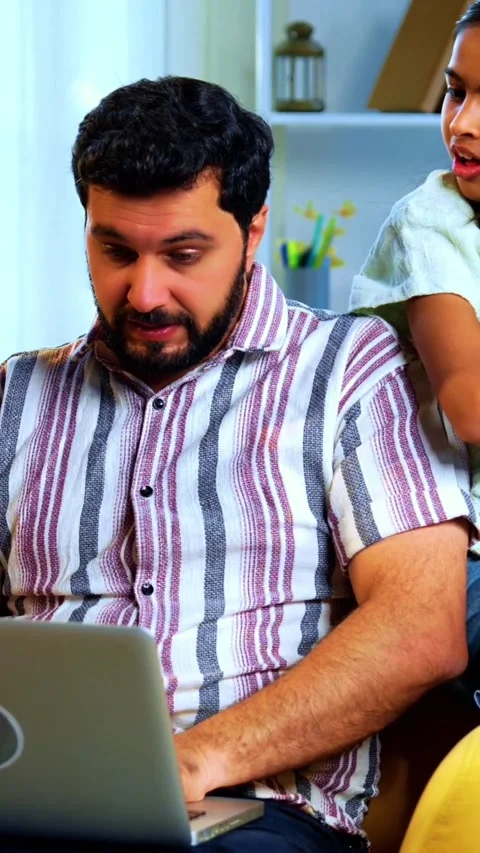 Indian young family using laptop computer at home surfing and shopping together 스톡 동영상 342804012
