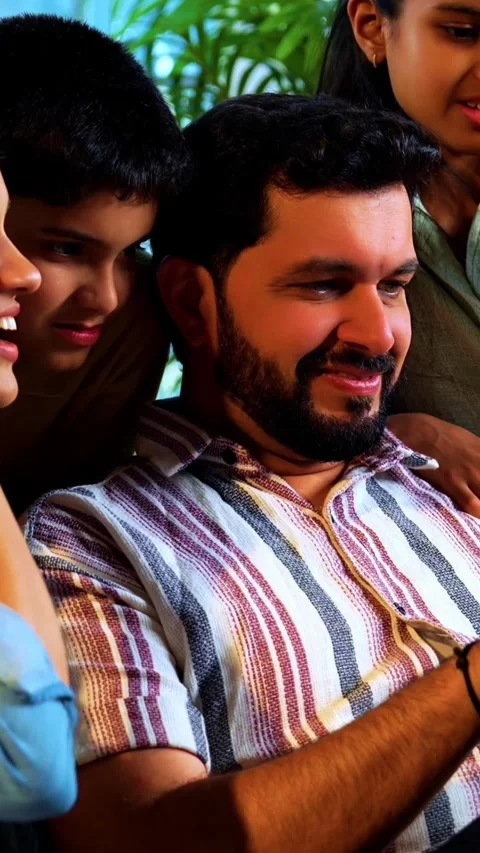 Indian young family using tablet computer at home browsing content together 스톡 동영상 342804029