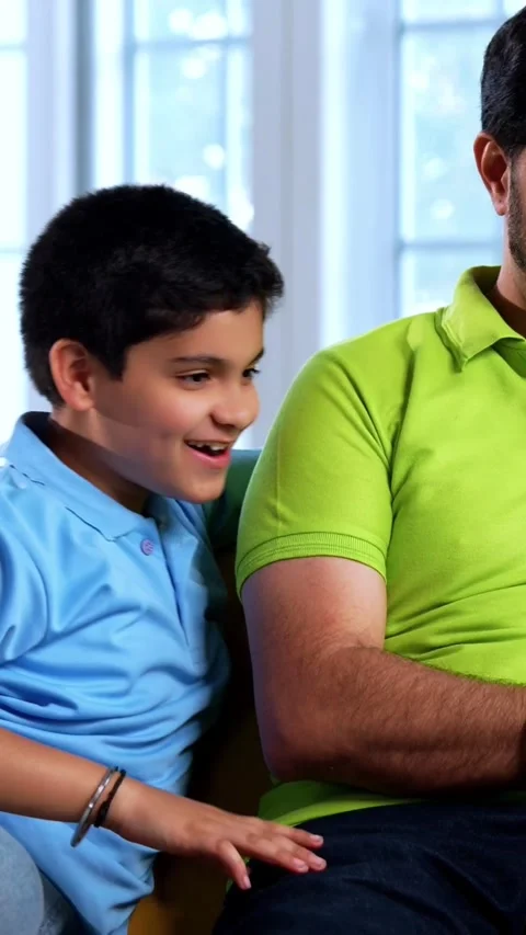 Indian young father son using laptop together for internet browsing, shopping Video stock 342758038