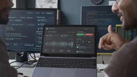 Indian Young Male Programmers Analyzing Software in Office 库存影片 337483900