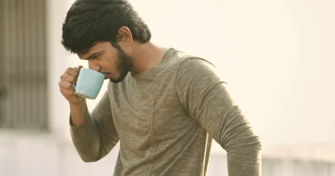 Indian young man drinking coffee Stock Footage 157167094