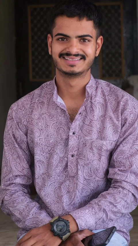 Indian Young Man Looking at Camera and Smiling Stock Footage 330738184