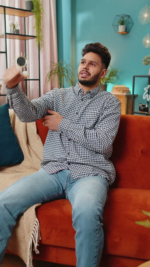 Indian young man man experiencing pain and discomfort in elbow arm joint and Stock Footage 278010594