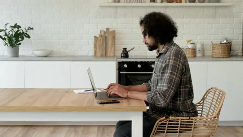 Indian young man using laptop studying working online at home Video stock 186962059